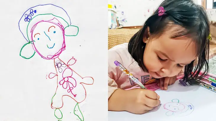 niña talentosa de dos años dibujando